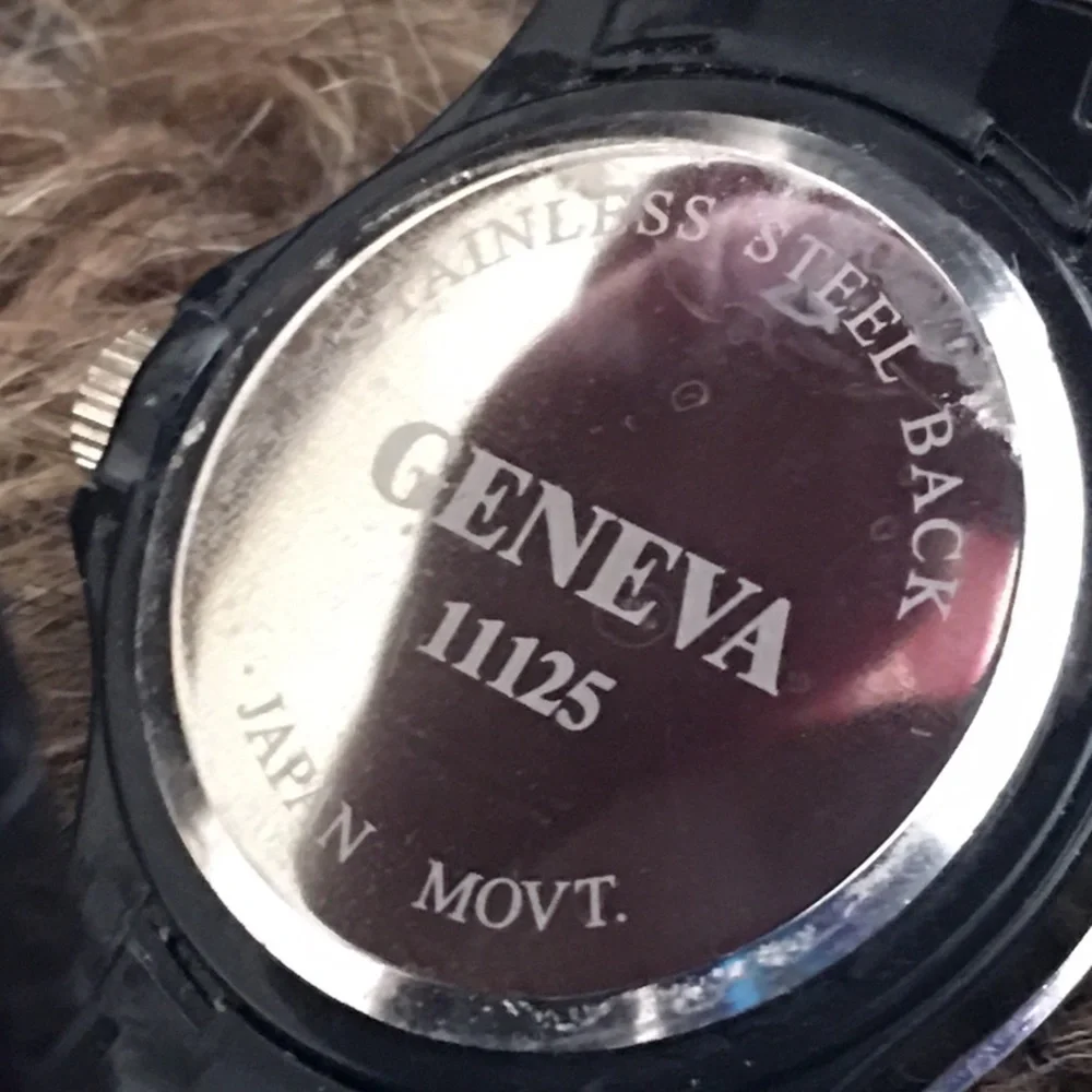 Ladies Geneva black plastic band rhinestone watch